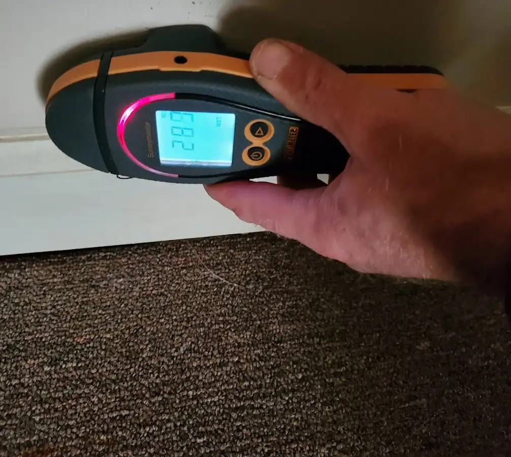 Moisture detection at baseboard during Burst Pipe Cleanup in Barrington
